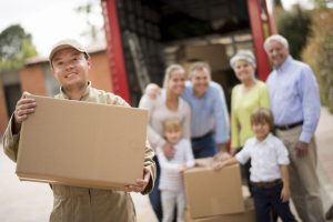 Mover helping family moving house